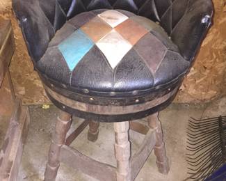 As found and yet to be cleaned is this fantastic leather stool with blocks of color. Though it stands alone, it could be the star of the bar when mixed with other stools. 