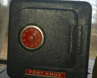 Pocket change and coins for children are safe in this vintage vault bank. 