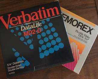 Yep, these old-school diskettes and disks do exist in their original box. A few more are also stashed in a handy diskette holder with flip-top lid. 