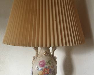 A ceramic lamp offers a bright spot with a patch of pretty posies. 