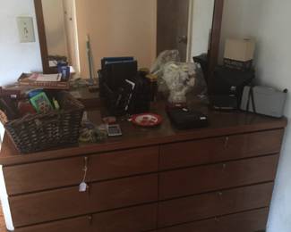 A sleek dresser with mirror has eight drawers offering plenty of space for clothes and more. 