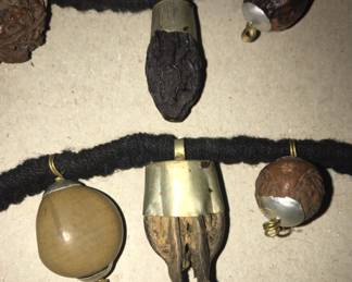 A closer look at some of the pieces on the unusual necklace. 