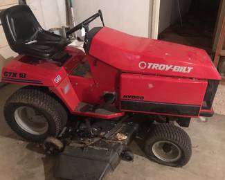 A Troy-Bilt riding mower has a new battery and is stored inside.  Notice, front tired need air or possibly replaced. 