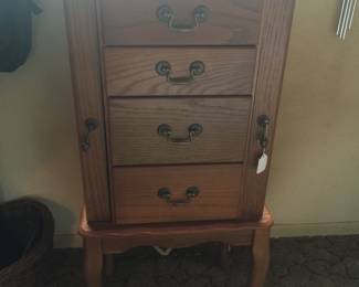 A jewelry armoire offers hooks for necklaces on either side plus drawers for rings, brooches, bracelets, earrings and more. 