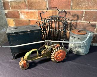Antique tractor sprinkler and other primitives.