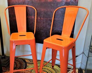Cute pair of orange high top chairs