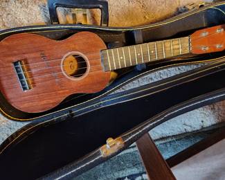 Uke and case, several other Ukes and other instruments