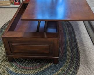 Coffee Table with top extended to use as table top.