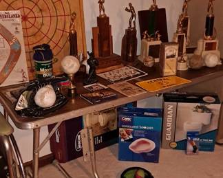 Assortment of Trophies (c. 1940s+), Signed Balls & Photos of Regional Baseball Teams; Vintage Carrom Board; Miscellaneous Health & Senior Care Equipment, including; Bed Pan; Toilet Rails; Raised Toilet Seat; Wheelchair and more.