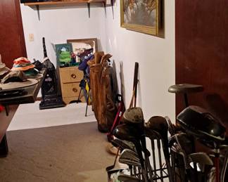 Assortment of home & sporting goods, including golf clubs; vacuum cleaner; mid-century modern night stand; golf wall art and other wall decor; men's hats; sporting trophies and much more!