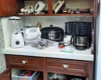 Lots of kitchenware, cookware, bakeware including, mixing bowl sets; crockpots; blenders; coffee makers; electric can opener; hand mixers and so much more!