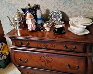 Bombe style chest; Tea and Coffee Pots; large wall clock; and assorted dishes.