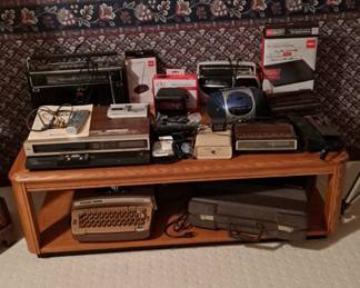 DVD & Video Player; Assorted Radios; Clocks; Electric Typewriter; Wood & Glass Top Coffee Table