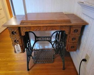 #1208 • Antique Singer Sewing Machine and Table.
