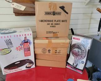 #1938 • George Foreman Grill, Shower Head and Microwave Plate Mate.
