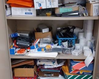 Storage cabinets full of office supplies, papers, Staples, paper clips label makers, you name it.