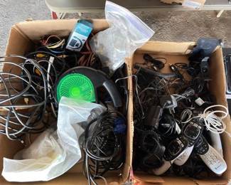 #10568 • (2) Boxes of Phone Chargers, Direct Tv Remotes, Tv Cables, CD & DVD Repair Device

