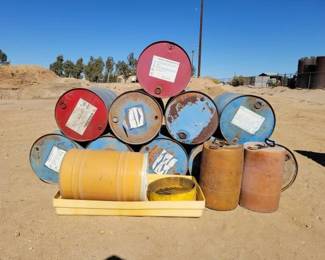 #1924 • 10 55Gal Drums, 3 Plastic Drums, 1 Plastic Drain Pan with Drum Funnel
