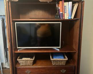 First bedroom on left - armoire with TV and drawers