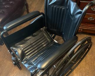 Wheelchair with legs in garage