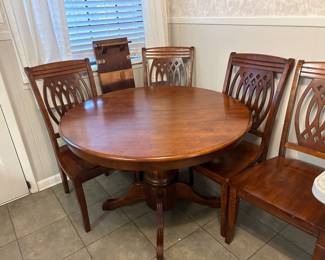 Solid wood table with leaf and four chairs