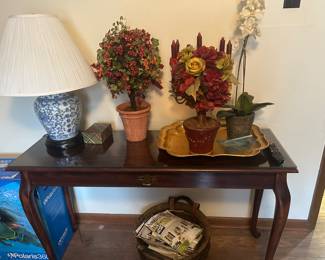 First bedroom on left - large table, decor, lamp