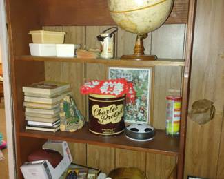 Stack of old child’s textbooks & Charles Pretzels Tin