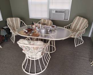 Six chair outdoor furniture kept in a covered porch