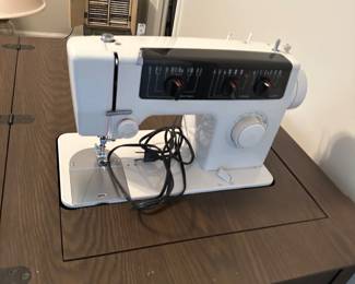 Sewing machine in cabinet
