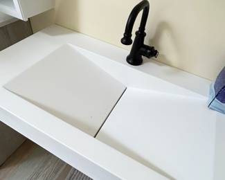 Rectangular center directed sink in master bath. 35.5” Buyer for responsible for removal.