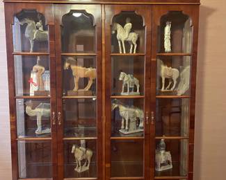Another display cabinets filled with great pieces purchased from their numerous travels