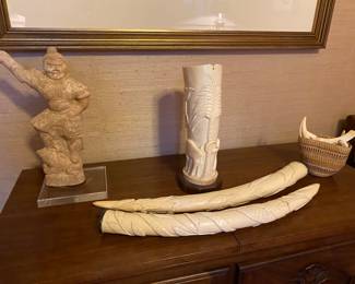 Attractive collection of carved ivory pieces throughout the home