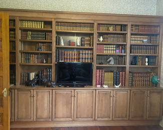 Unbelievable sets of lovely leather books throughout the home 
