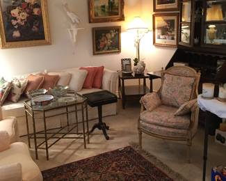 art, rug, chairs, throw pillows, photo frames, ginger jars, china cabinet with writing desk