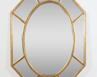 282	Friedman Bros. Hollywood Regency Style Mirror	"Hollywood Regency style mirror by Friedman Bros. 20th century. Octagonal form mirror with beveled panels and gilded frame. Friedman Bros. label on back of mirror.  Light scuffs and wear to mirrored surface. Wear throughout frame. 

37"" x 48 7/8"". 33 lbs."
