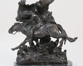 325	After Frederic Remington Bronze The Horse Thief	After Frederic Remington (American, 1861-1909). Bronze sculpture, Horsethief. On a marble base. Signed on the base of the bronze. 10 1/2"H x 10 1/8"W including base. Minor chips to the edges of the marble base.
