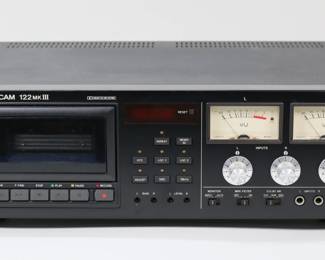 392	Tascam 122 MKIII Cassette Deck	Tascam 122 MKIII cassette player. Serial number 7400078 972 .Turns on, untested. With original manual. 19"W x 14"D x 6"H. Scratch to one corner of mount.
