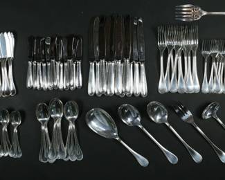 257	87 Pieces Christofle Perles Silverplate Flatware	87 piece Christofle French silverplate in the Perles pattern. Service for 11+. 12 knives, 11 forks, 11 salad forks, 11 teaspoons, 12 tablespoons, 12 fish knives, 12 butter spreaders, 3 serving spoons, ladle, 2 serving forks. Knives 9 5/8"L, forks 8 1/8"L. Some scratches, tines bent on one fork, one serving fork heavily tarnished.
