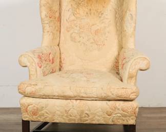 51	19th Century Chippendale Style Wing Chair	"19th century Chippendale style wing chair. Mahogany block legs and stretcher with later floral upholstery. Chips, scuffs, marks, and wear throughout wood on legs and stretcher. Staining, fraying and wear throughout upholstery. Tear to upholstery on back of chair. Losses to upholstery on chair's left wing.

36"" W x 28"" D x 42 1/2"" H. 60 lbs."
