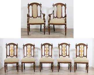 220	Seven Aesthetic Movement Dining Chairs	"Seven Aesthetic Movement dining chairs with Eastlake attributes. Five side chairs and two armchairs with carved splats and finials. Armchairs with upholstered splats. Wear throughout wood and upholstery on all chairs. Scratches and scuffs to legs throughout all chairs. Repairs to finials on one armchair and side chair. Chip and loss to wood on back of two side chairs. Losses and wear to gilding on legs, arms, and splats. Tarnishing and wear to brass caps on front feet. One brass cap is missing from foot of one armchair. Splits and repairs to carved top rail on one side chair. Loss to carved circular motif on chair with repaired rail.
Side chair: 20"" W x 22 1/4"" D x 38 5/8"" H. 18 1/2"" seat height. Armchair: 24 1/2"" W x 25 1/2"" D x 42 1/2"" H. Arm height 28"" H, seat height 20 1/2"" H. 150 lbs total."
