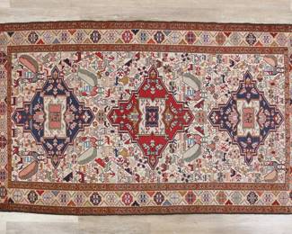 394	Caucasian Style Animal Motif Rug	"Caucasian style rug. Animal motifs and geometric forms against polychromatic field. Tattering, wear, and staining to fringed edges. Slight wear and warping throughout rug. 

3' 11 3/4"" x 6' 7 1/2"" .8 lbs."
