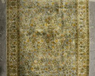 337	Persian Rug	"Persian rug. Blue and gold with floral motifs throughout. Losses to fringe on both sides. Two stains on either side of rug. Vertical creasing to rug near center.

12' 3"" x 8' 11""."
