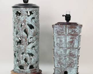 178	2 Chinese Bronze Archaic Style Lamps	2 archaic style Chinese bronze table lamps. Green patina, both mounted on wooden bases. 21 1/4"H and 17"H (heights to tops of sockets). Smaller lamp socket loose and not working.
