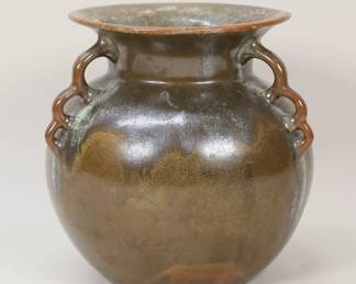 319	Selden Bybee 3 Handled Pottery Vase	Selden Bybee pottery vase. Three handles, brown glaze, shape # 505. Signed and dated on the underside 1927 Selden Bybee with Kentucky mark, 505. 7 1/2"H. Some glaze pops and minor roughness to the glaze on the rim.
