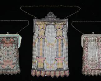 233	3 Whiting & Davis Art Deco Mesh Bags	"3 signed Whiting & Davis mesh purses, all with silver tone frames and art deco geometric motifs. Orange, yellow and white bag with yellow and green enamel frame, 4 3/8""W x 6 3/8""L including clasp; bag with pink and red, 3 3/4""W x 6 5/8""L; large bag column motif in pink, yellow, gray and black , 5 3/8""W x 10 1/4""L.

Bag with enamel frame losses to color on frame and some losses to color on mesh; losses to color on pink and red bag, large bag losses to color."
