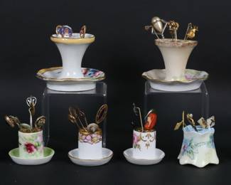 245	39 Stick Pins With Porcelain Holders	Lot of 39 vintage stick pins, including International Tailoring Co., gold tone, silver tone, Mercedes Benz, figural, advertising, organizational, signed Trifari pear stick pin. With 8 porcelain stick pin holders, including Limoges, Nippon, hand painted. Pear stick pin 2 7/8"L, largest Nippon holder 2 5/8"H.
