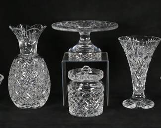 429	6 Pieces Waterford Crystal	6 piece Waterford Crystal lot. Glendon vase, 10"H; "pineapple" form flower vase, 12"H; cake stand, 5"H x 10"-diameter; 2 Glandore pattern bowls, larger 4"H x 9"-diameter; Glandore biscuit jar with lid, 6"H. All with etched Waterford marks. Glendon vase large chips to the rim, Glandore bowls both with chips to the rims, all with scratches to the undersides.
