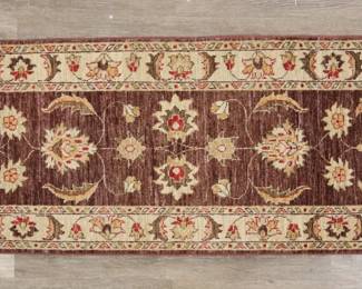 346	Persian Style Runner Rug	"Persian style runner rug. Floral motifs against beige and brown field. Wear, fading and pilling throughout runner. Losses to fringe on either side. 

2' 1 1/2"" x 6' 3 1/2"". 6 lbs."
