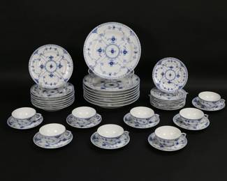 308	40 Pieces Royal Copenhagen Blue Fluted Dinnerware	Royal Copenhagen porcelain dinner service for 8, in the Blue Fluted Half Lace pattern. 40 pieces, including 8 dinner plates, 8 salad plates, 8 bread & butter plates, 8 cups and 8 saucers. Dinner plates 10"-diameter. All with Royal Copenhagen Denmark marks to the undersides.
