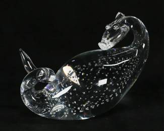 144	Steuben Crystal Dragon Figure	Bernard X. Wolff for Steuben, crystal control bubble dragon. Signed on the underside Steuben SHS and numbered 305/600. 7 1/2"L x 5 7/8"H. Large chip to horn on top of head.
